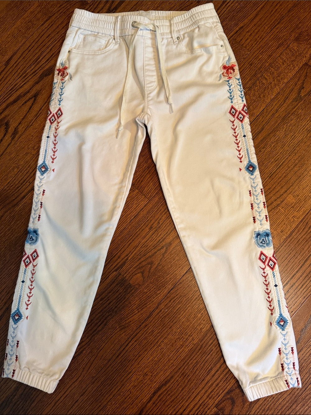 DRIFTWOOD White Denim Embroidered 
Joggers.